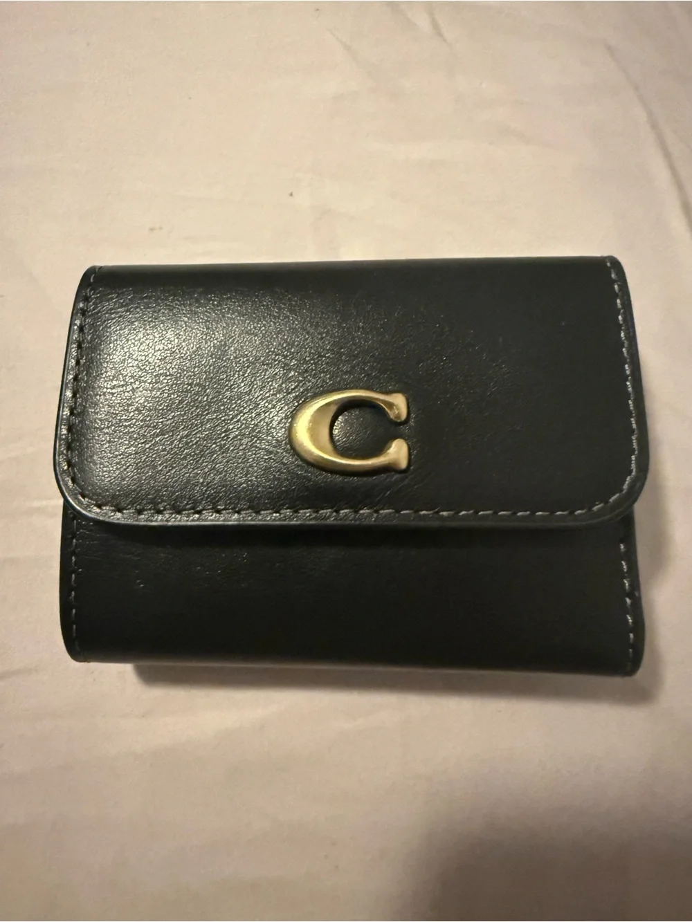 Coach Black Leather Compact Wallet with Gold 'C' Accent